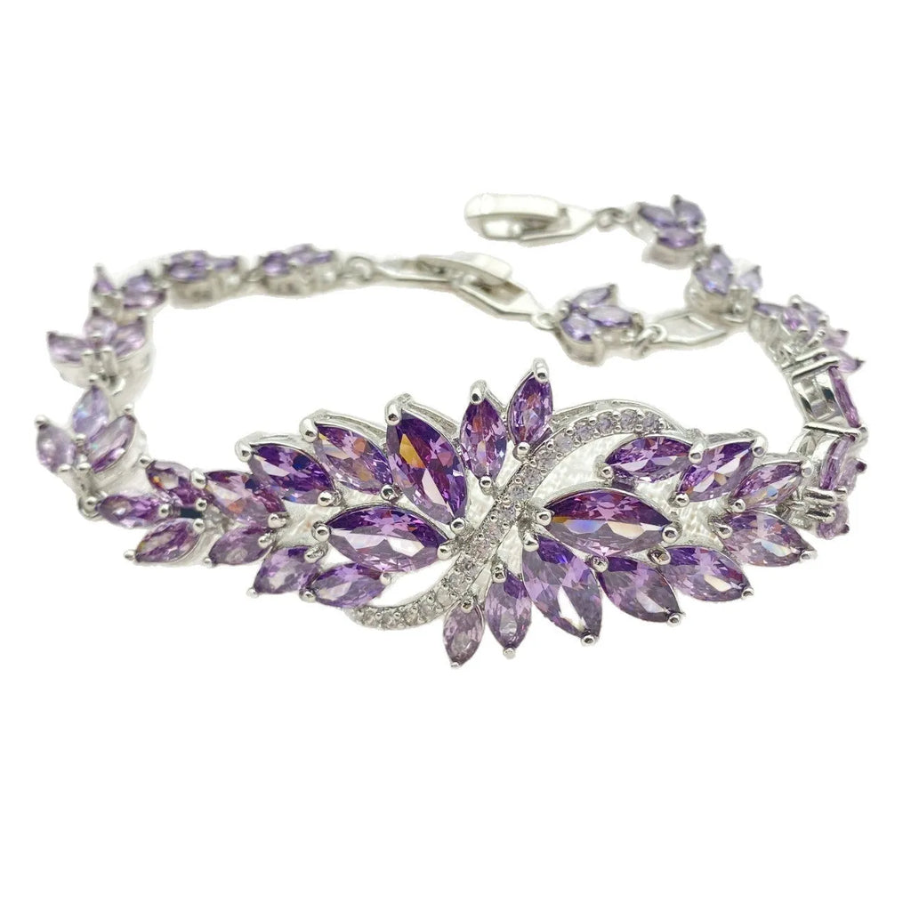 Copper fashion bracelet with gold electroplating and coloured zircon stones in ice flower design