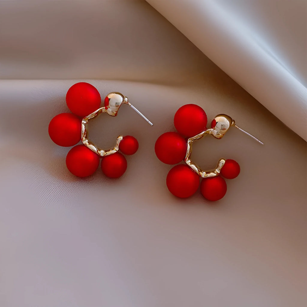 Women's red bell-shaped alloy earrings with drop pendant design