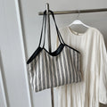 Striped cloth Korean style bucket shoulder messenger bag with beige ribbon scarf and woven belt detailing, soft horizontal square shape