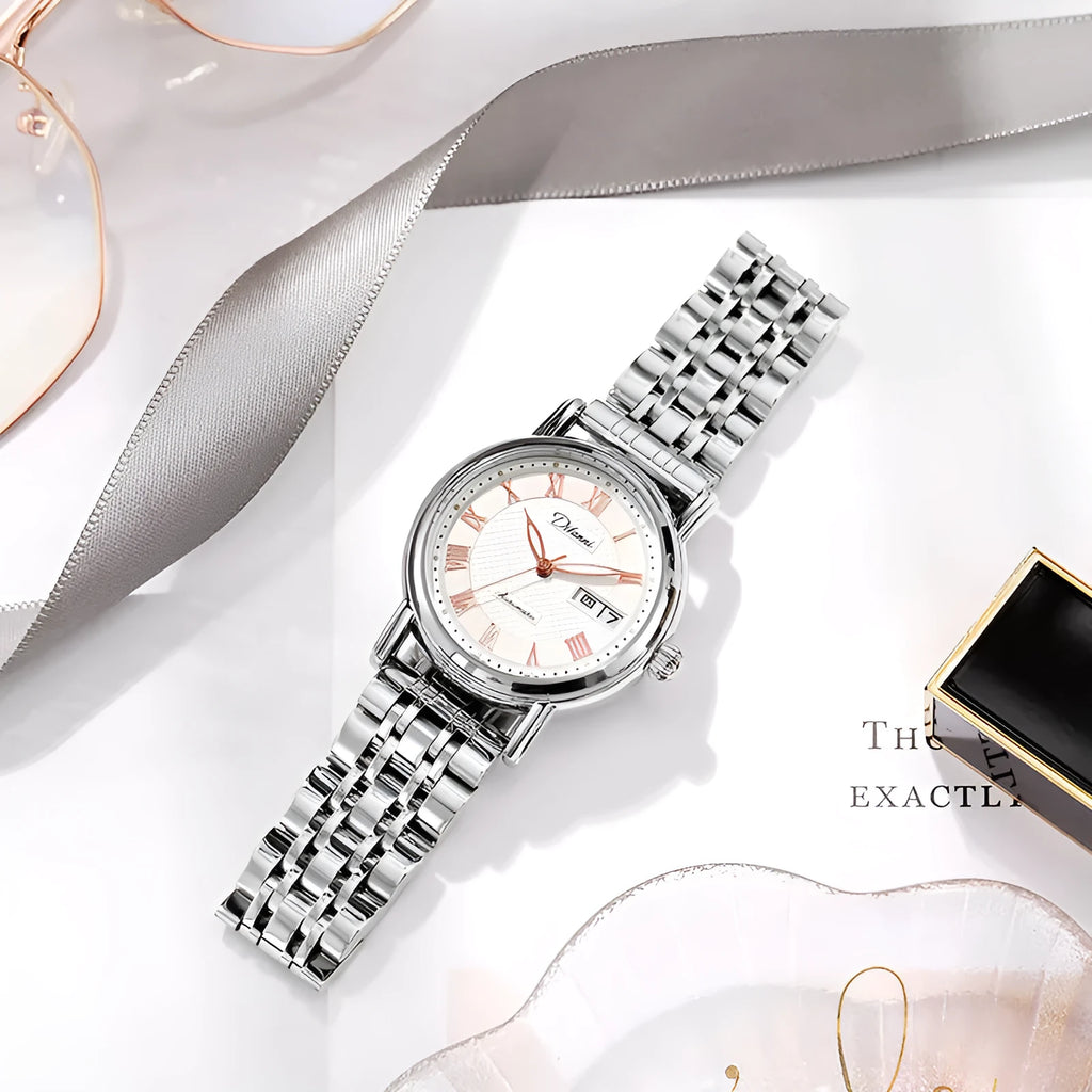 Women's automatic mechanical watch with leather and steel strap options on a white dial.