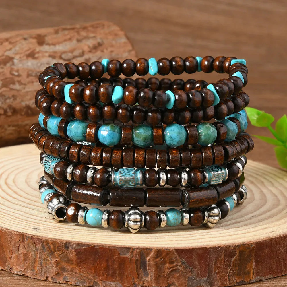 Set of seven retro bracelets with wooden beads and alloy charms in multicolour