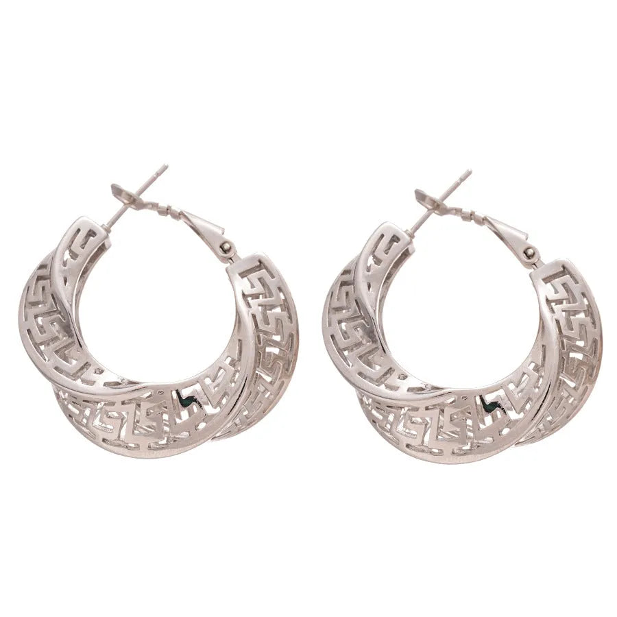 Geometric women's hollow stud earrings in gold or silver with exaggerated twisted round design