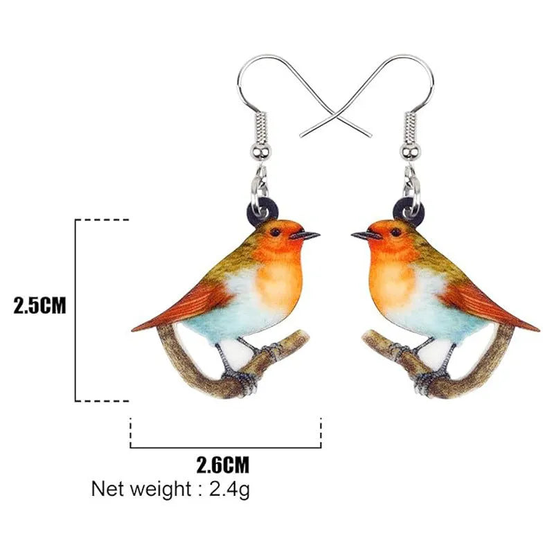 Blue titmouse bird design acrylic pendant earrings with geometric and snake detailing.