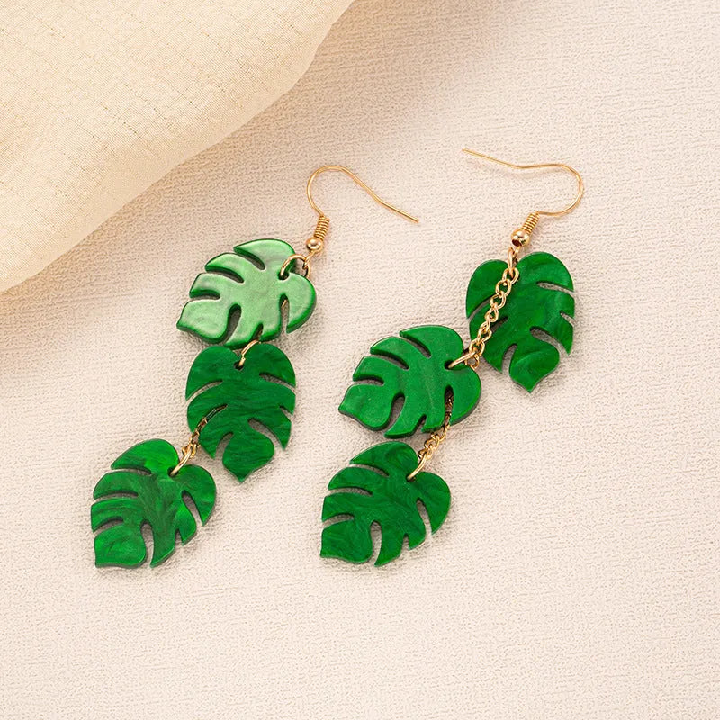 Women's alloy drop earrings with red and green acrylic jackfruit and coconut charms on a white background.