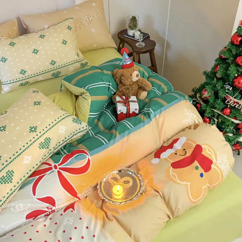 Christmas cartoon printed four-piece bedding set with quilt cover, sheet, and pillowcases on a bed.