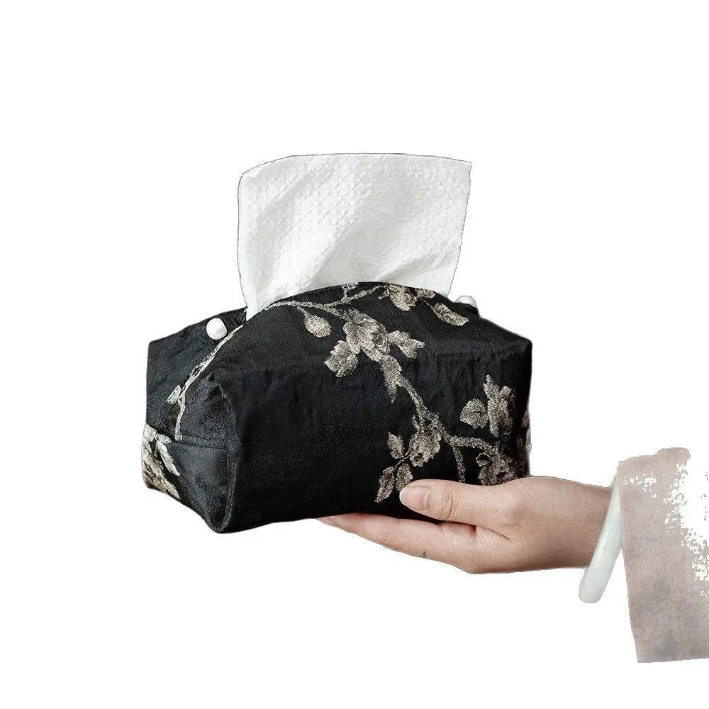 White embroidered Chinese brocade fabric tissue box with optional pearl buckle, shown on a table.