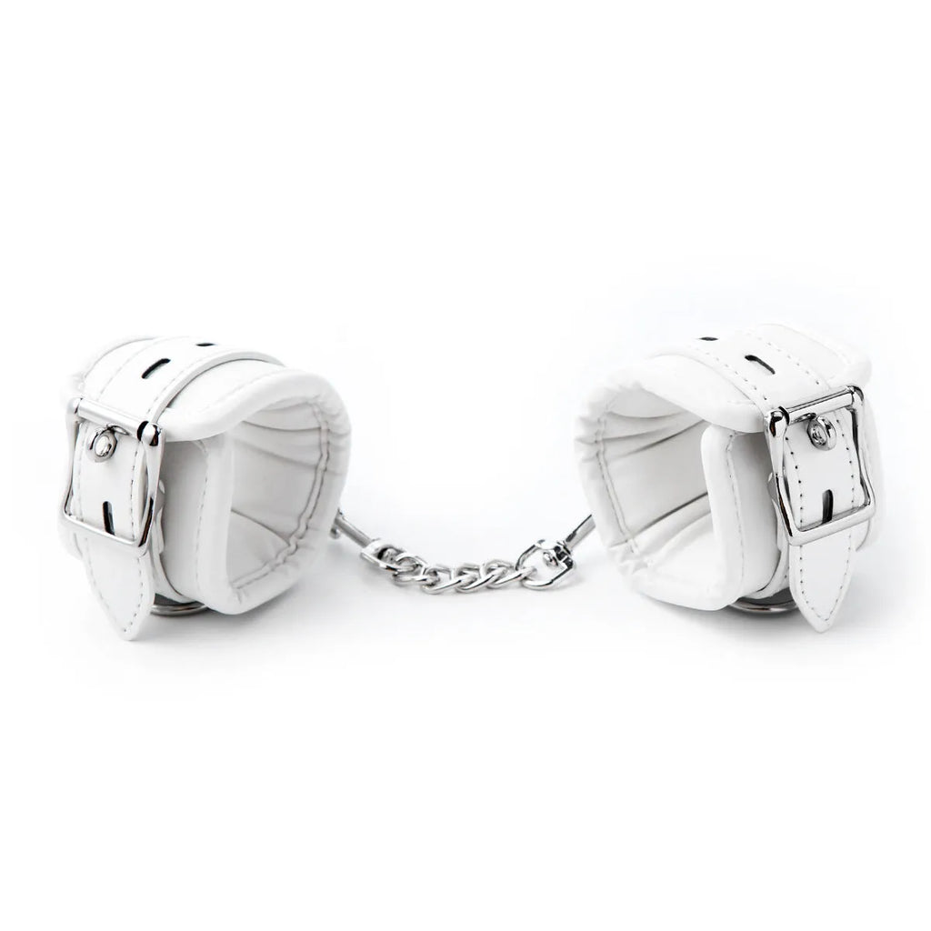 White PU sponge adult bondage set showing handcuffs, footcuffs, and a neck scarf.