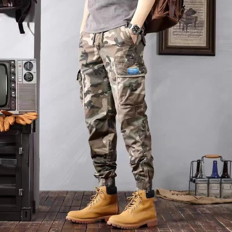 Men's camouflage cargo pants with multiple pockets and loose tapered fit