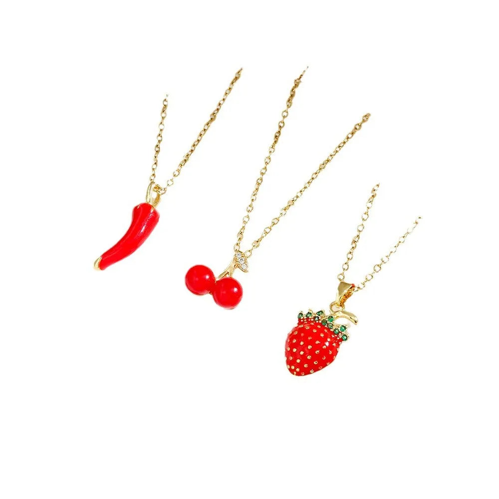 Titanium steel necklace with a delicate cherry charm on an O-ring chain.
