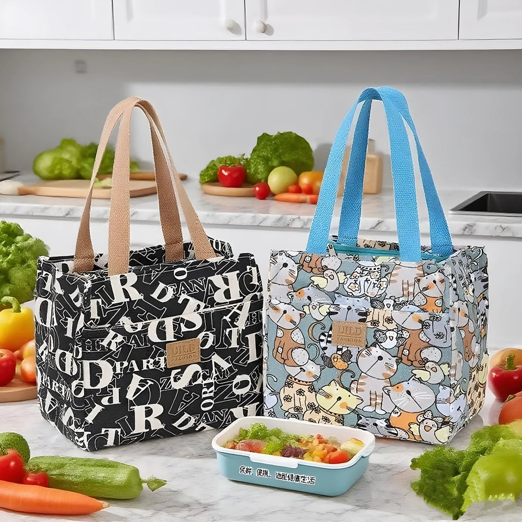 Women's printed canvas tote bag with aluminium hardware in a choice of floral and cat designs.