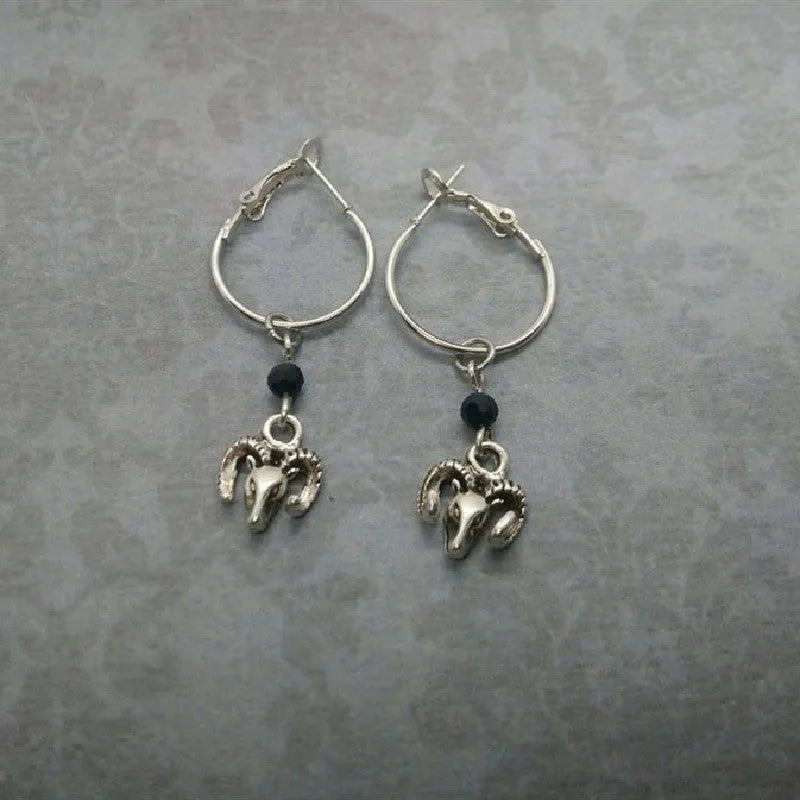 Silver round ring alloy earrings with Tibetan antelope design from Yunnan.