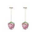 Geometric zinc alloy women's earrings with a red strawberry charm on a white background.