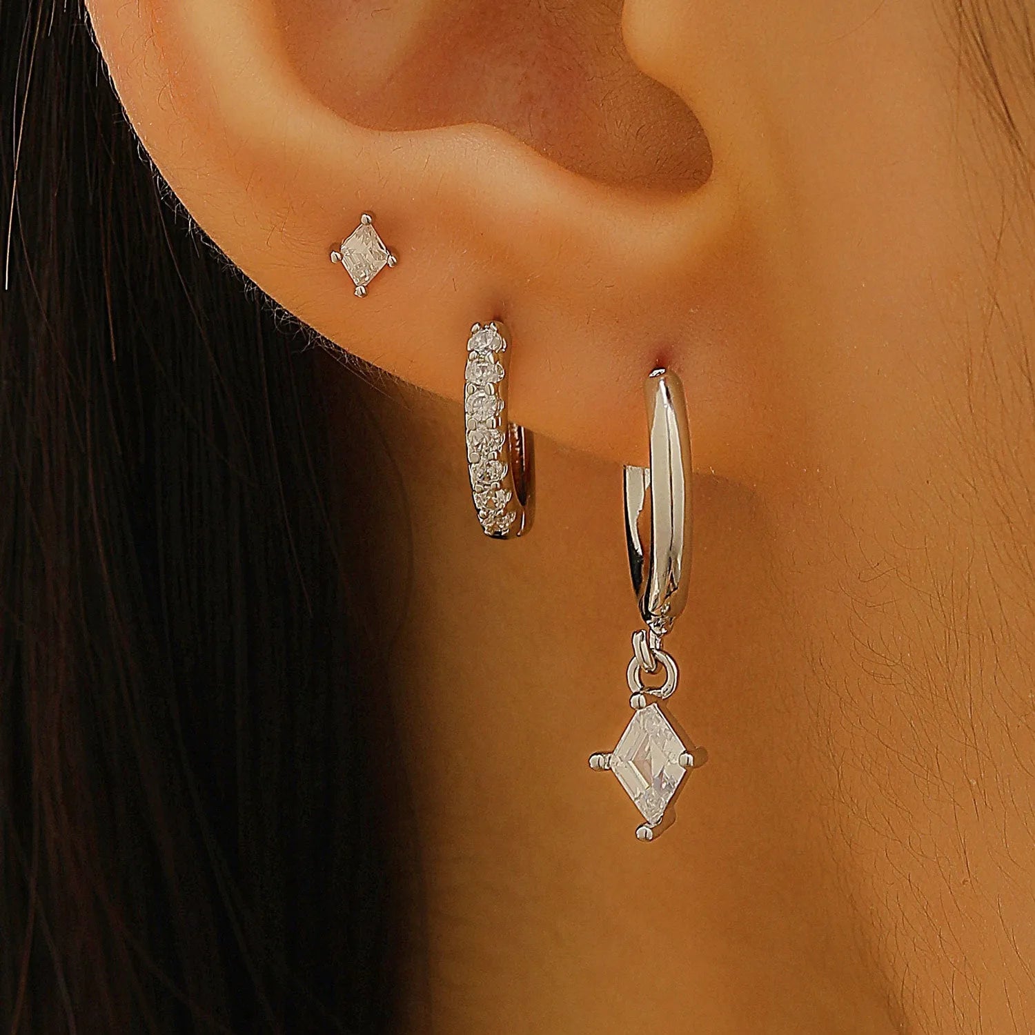 Ladies geometric zircon earring three-piece set in gold and silver colours showing pendant, stud, and clip styles