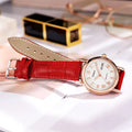 Women's automatic mechanical watch with leather and steel strap options on a white dial.