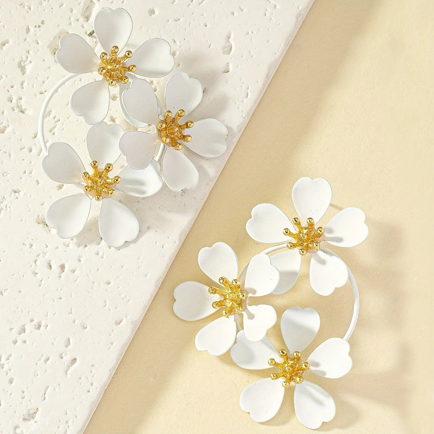 Retro flower-shaped iron earrings for women in black and white colour options.