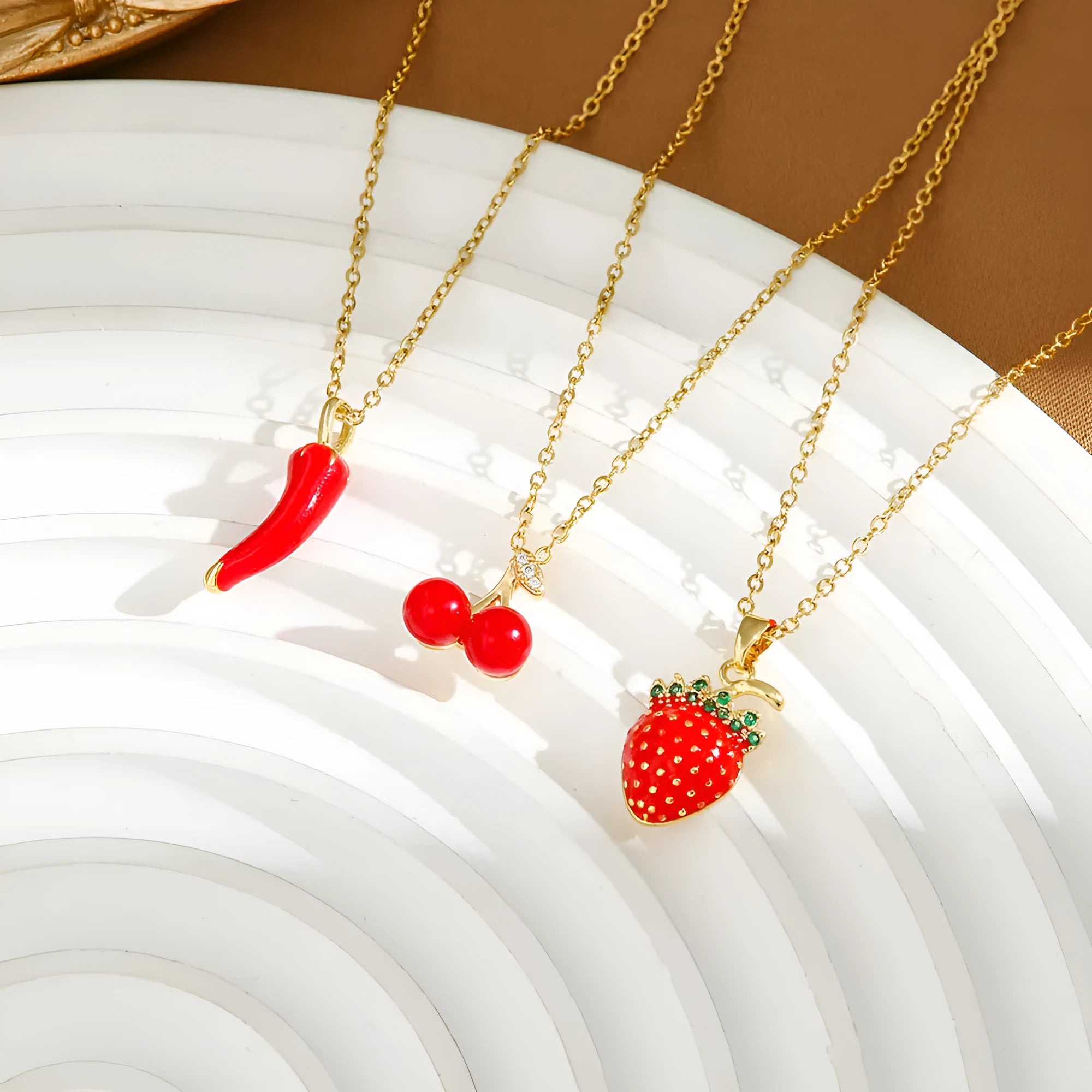 Titanium steel necklace with a delicate cherry charm on an O-ring chain.