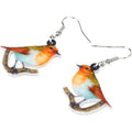 Blue titmouse bird design acrylic pendant earrings with geometric and snake detailing.