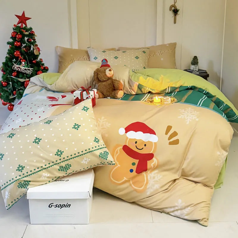 Christmas cartoon printed four-piece bedding set with quilt cover, sheet, and pillowcases on a bed.