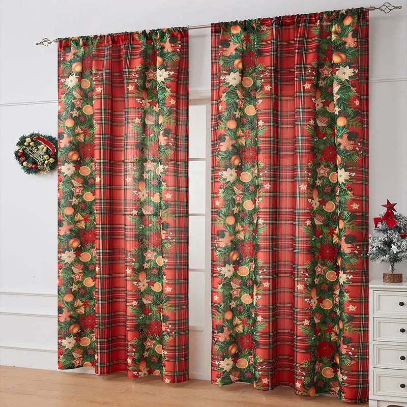 Rectangular printed polyester curtain with festive design hanging in a window