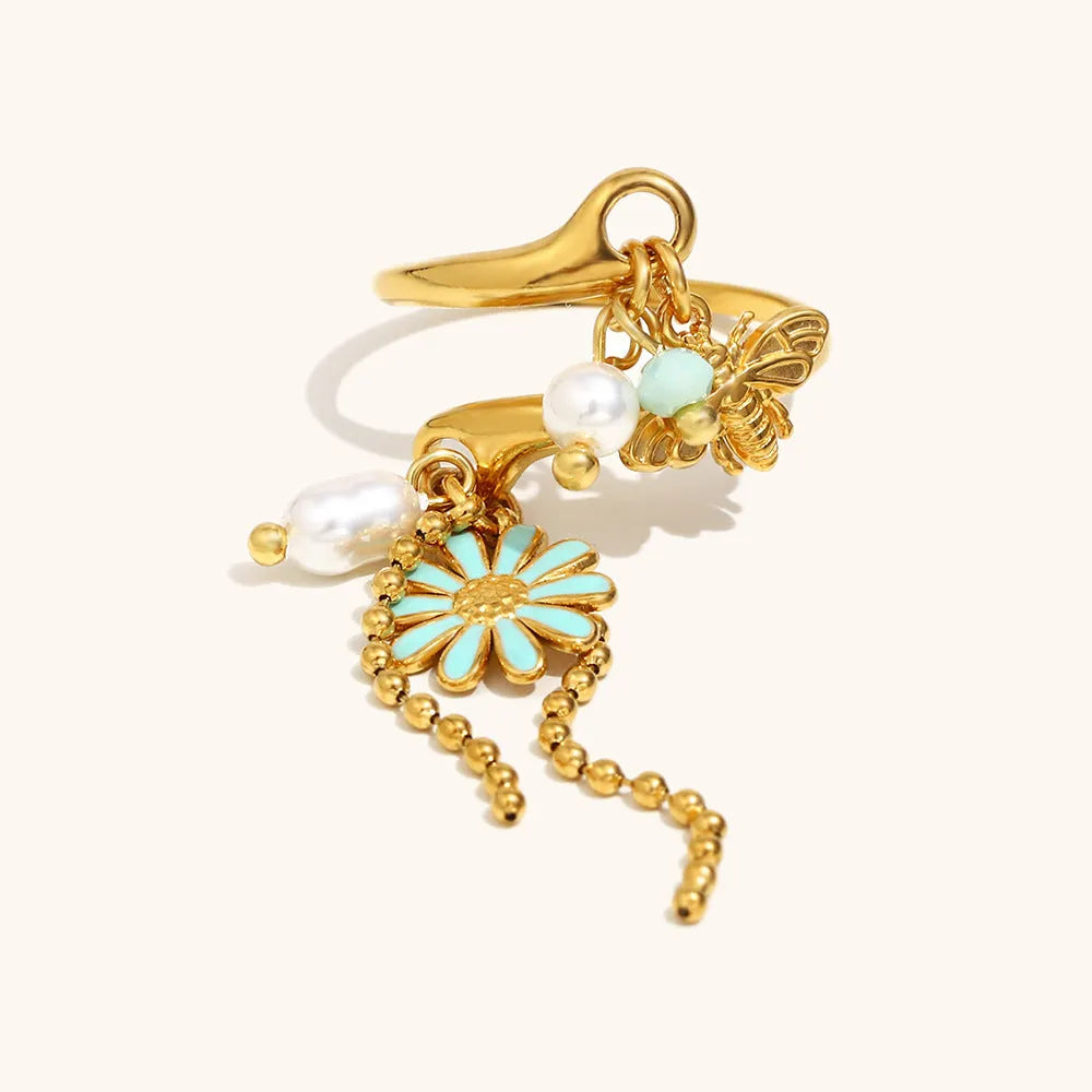 Tassel open ring in stainless steel with 18K gold plating featuring bee and daisy design