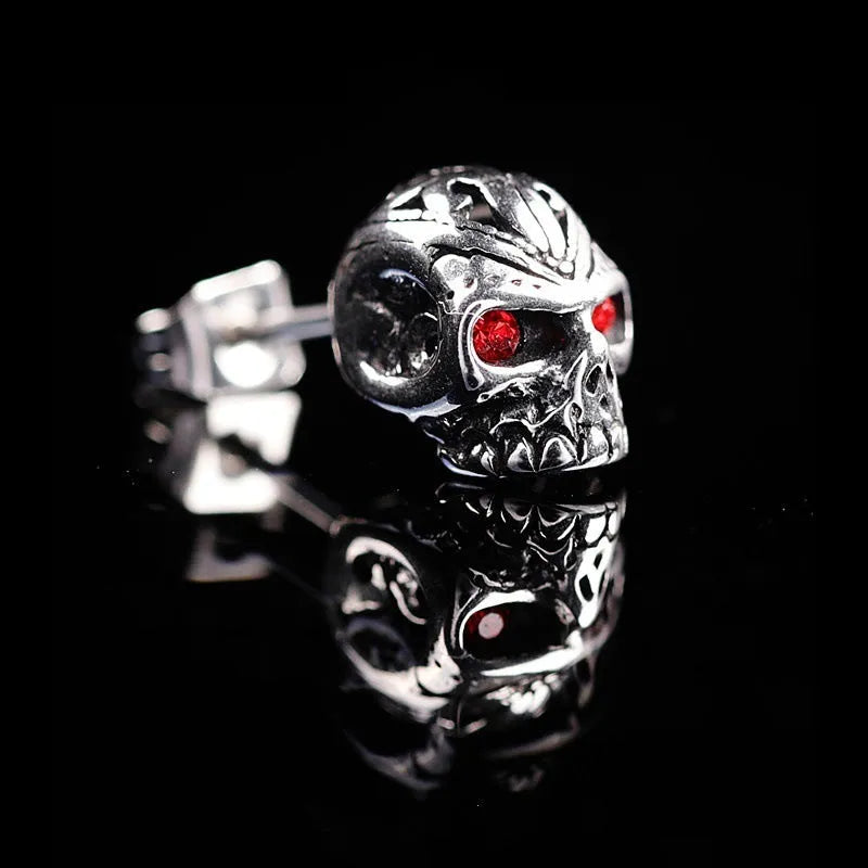 Retro ghost head skull stud earrings with red eye detailing on electroplated alloy