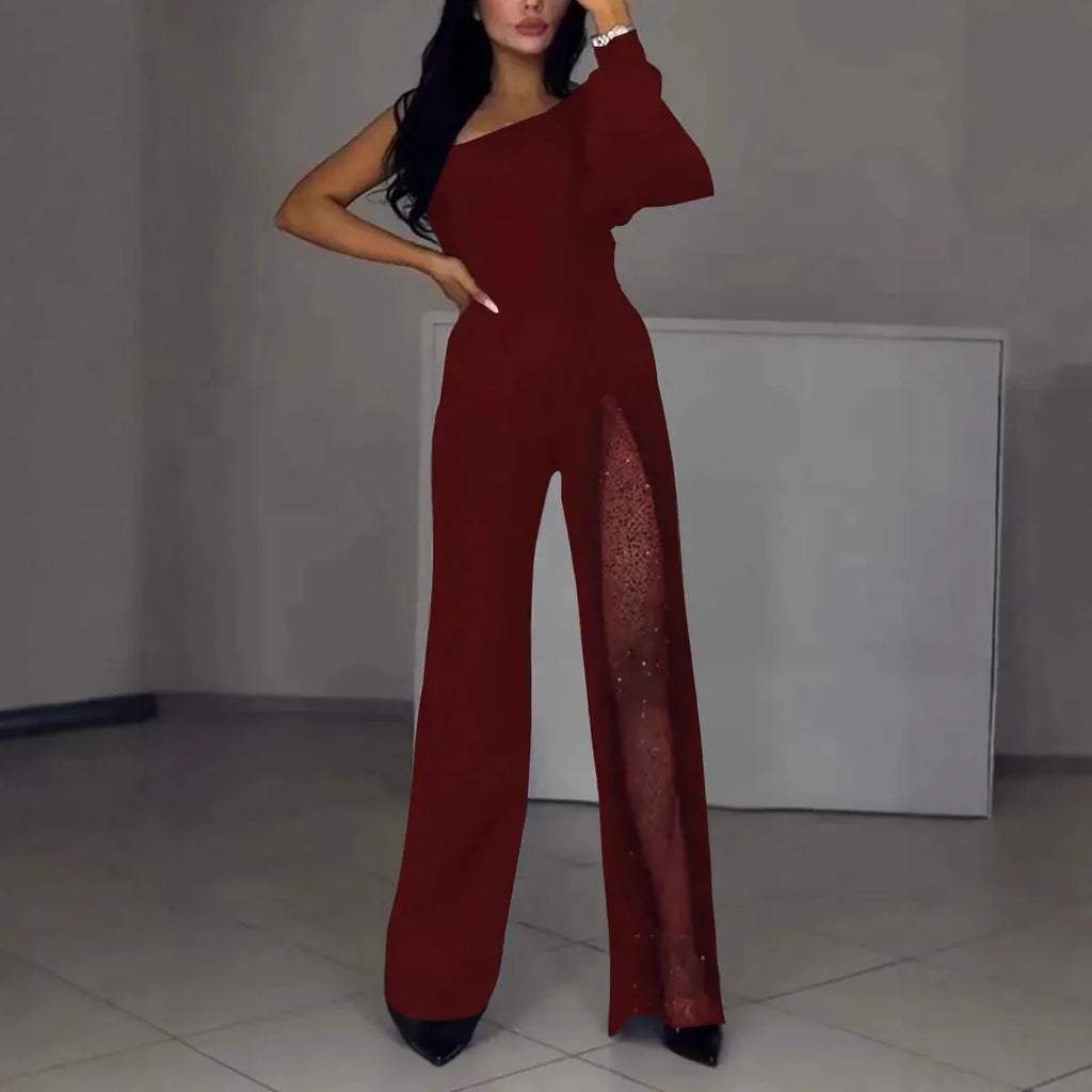 Black women's long-sleeve jumpsuit with an oblique shoulder neckline and a high slit on the leg.