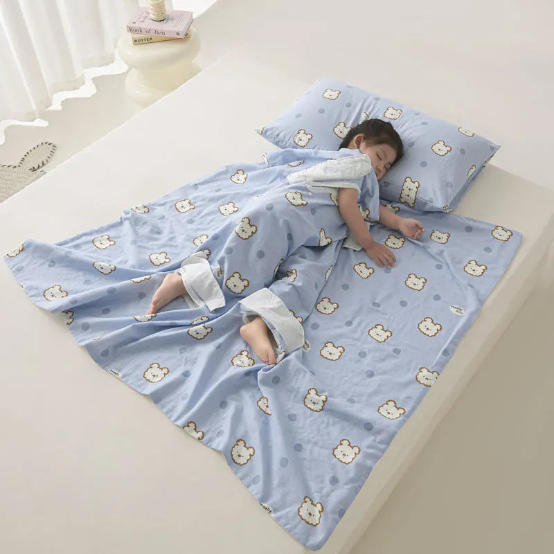 Patterned anti-kick sleeping bag blanket laid flat on a bed, showing its quilted texture.