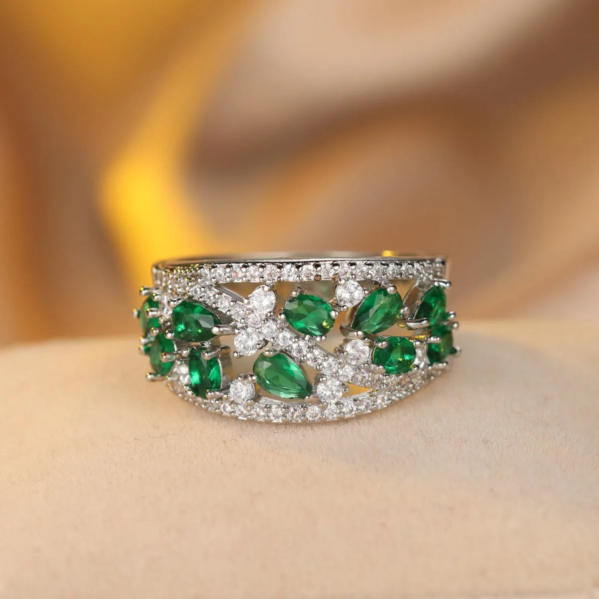 Women's copper hollow round fashion ring in gold or platinum with white or blue accent, shown on a hand.