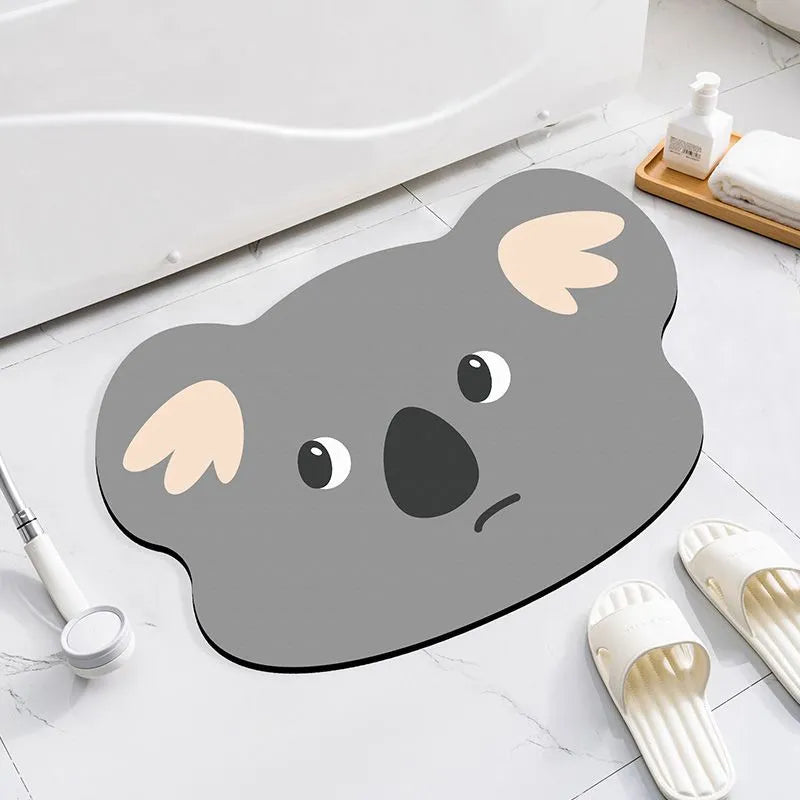 Thickened diatom oil bathroom mat with cartoon animal design in alien shape for shower area water absorption.