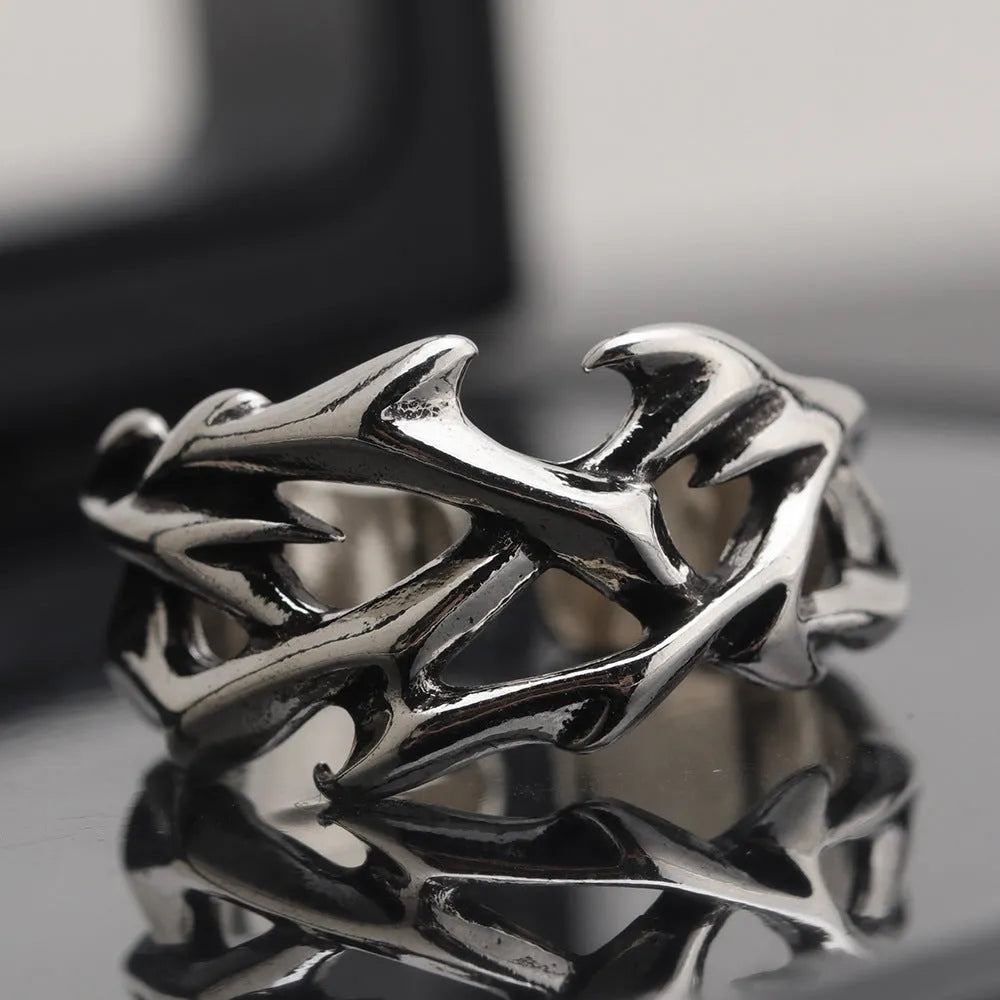 Copper men's ring with geometric thorn flower design and adjustable opening.