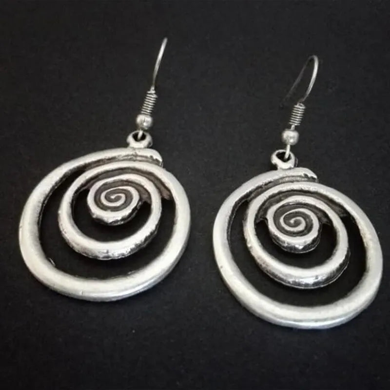 Geometric spiral earrings with distressed silver finish, measuring 5cm long