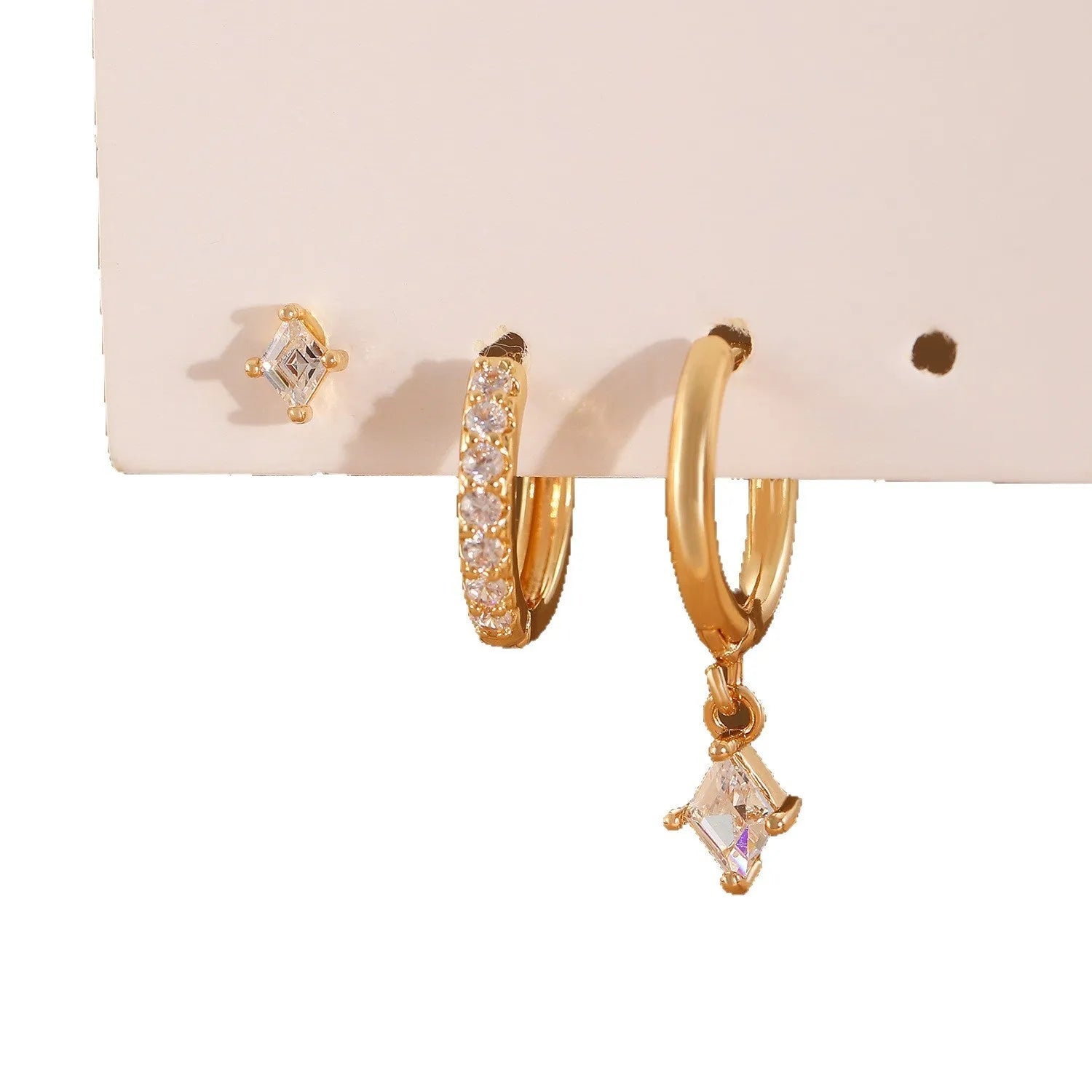 Ladies geometric zircon earring three-piece set in gold and silver colours showing pendant, stud, and clip styles