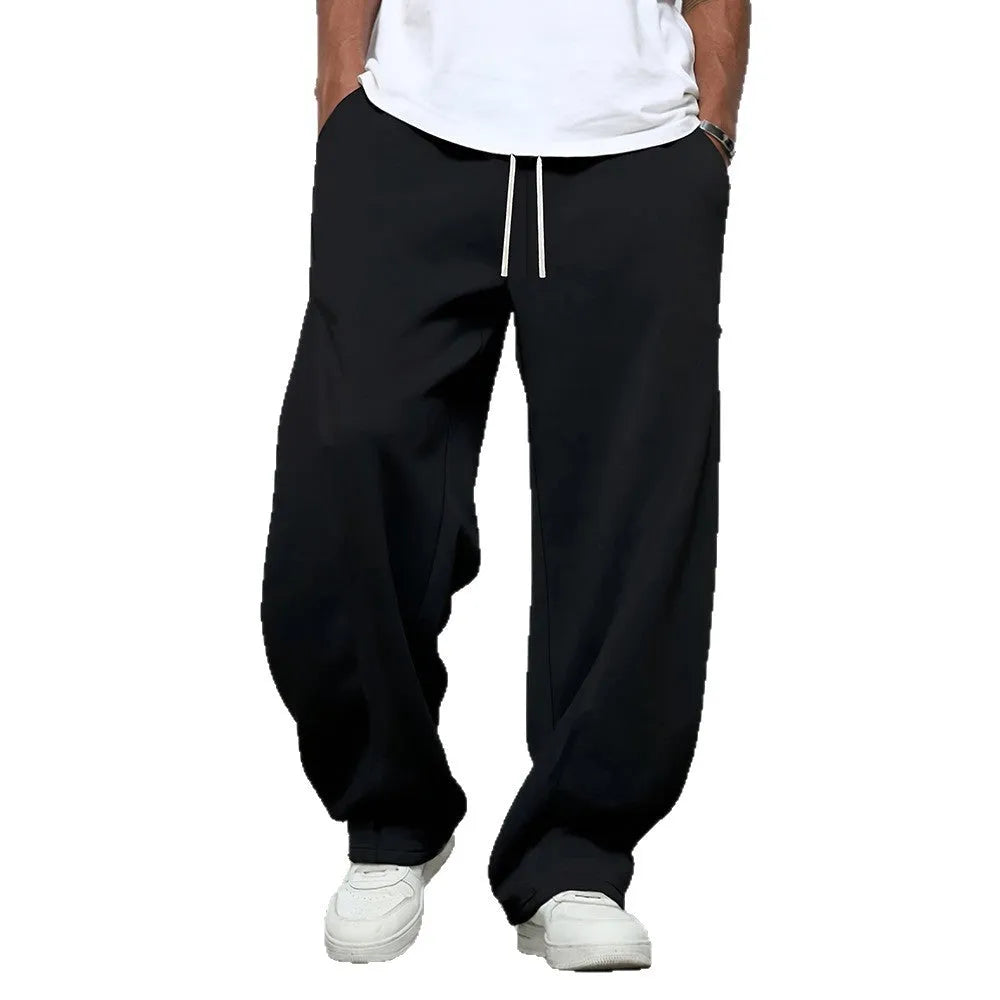 Men's straight-leg casual trousers in black with an elastic drawstring waistband.