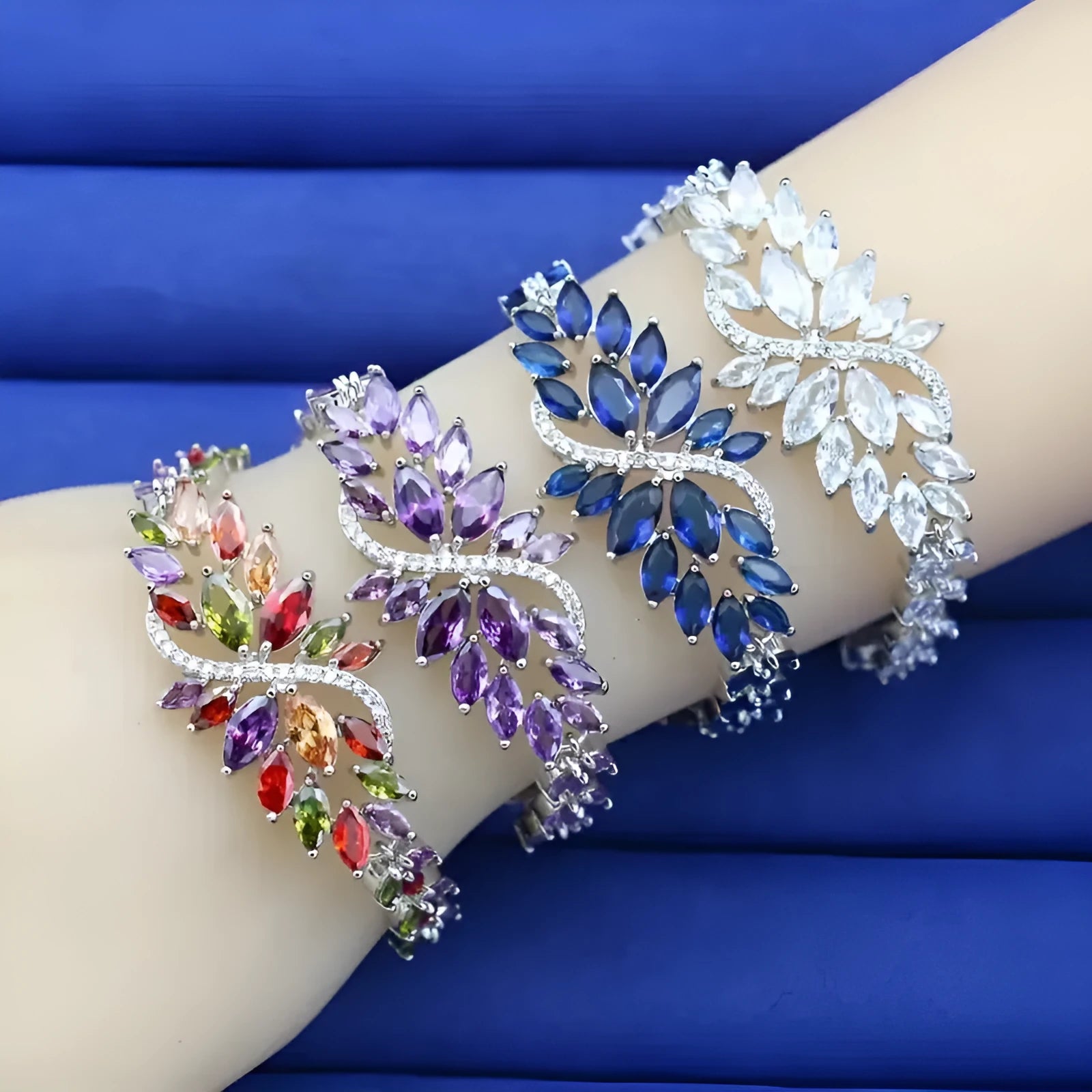 Copper fashion bracelet with gold electroplating and coloured zircon stones in ice flower design