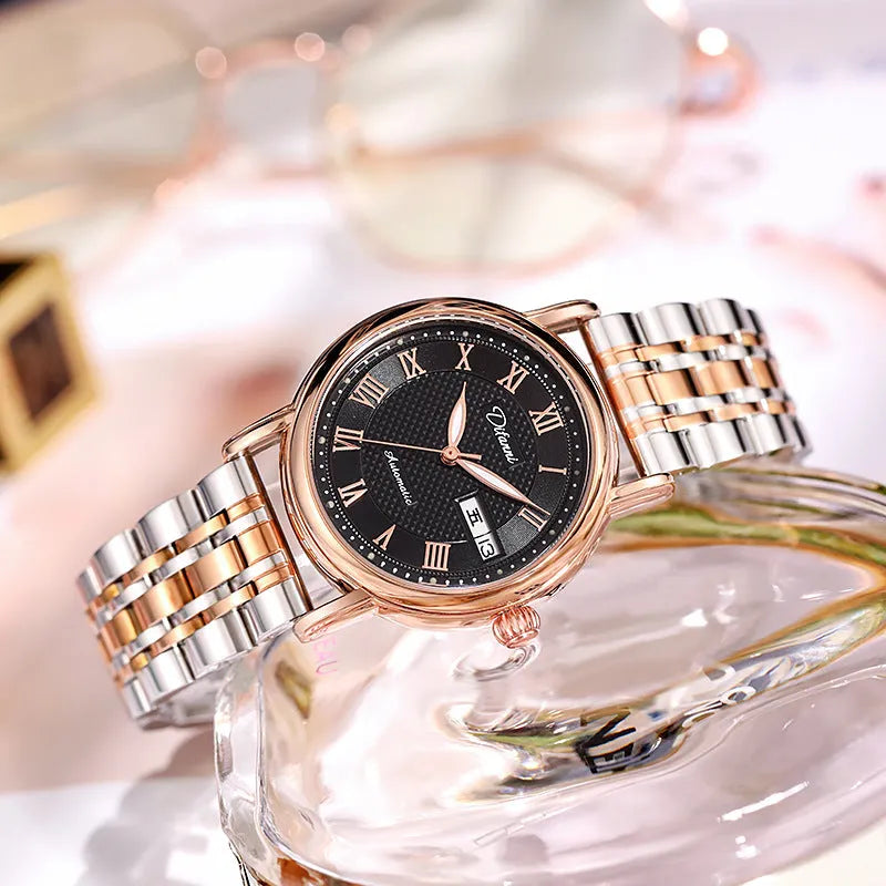 Women's automatic mechanical watch with leather and steel strap options on a white dial.