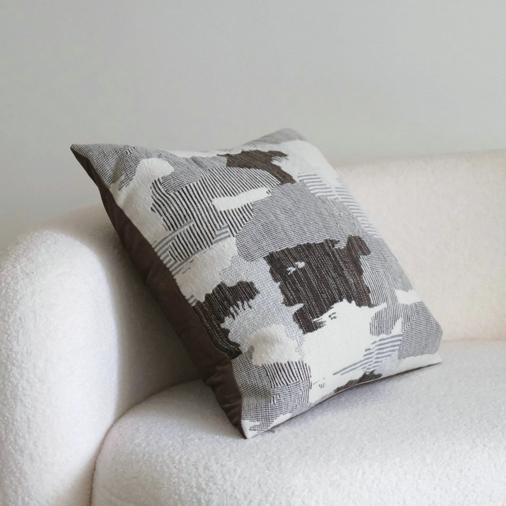 Coffee brown mid-century modern striped cushion on a sofa, showing 30x50cm and 45x45cm size options.