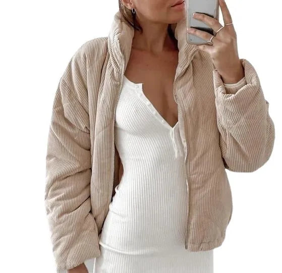 Apricot coloured women's corduroy jacket with a stand collar, front zipper, and long sleeves.