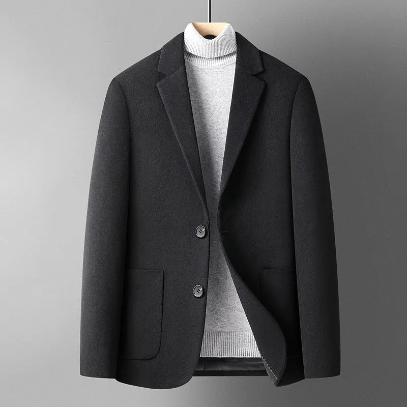 Men's slim fit wool suit jacket in grey shown on a hanger.
