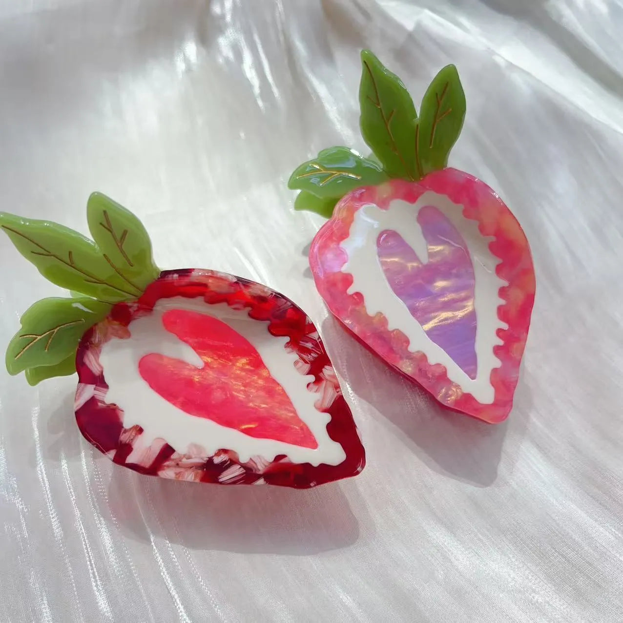 Handcrafted strawberry hairpin in pastoral style showing red and pink colour options