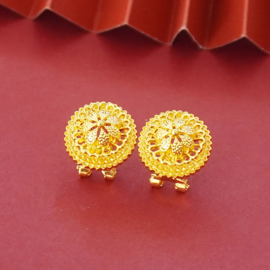 Gold-plated women's three-piece jewelry set showing necklace with floral pendant, matching earrings, and ring