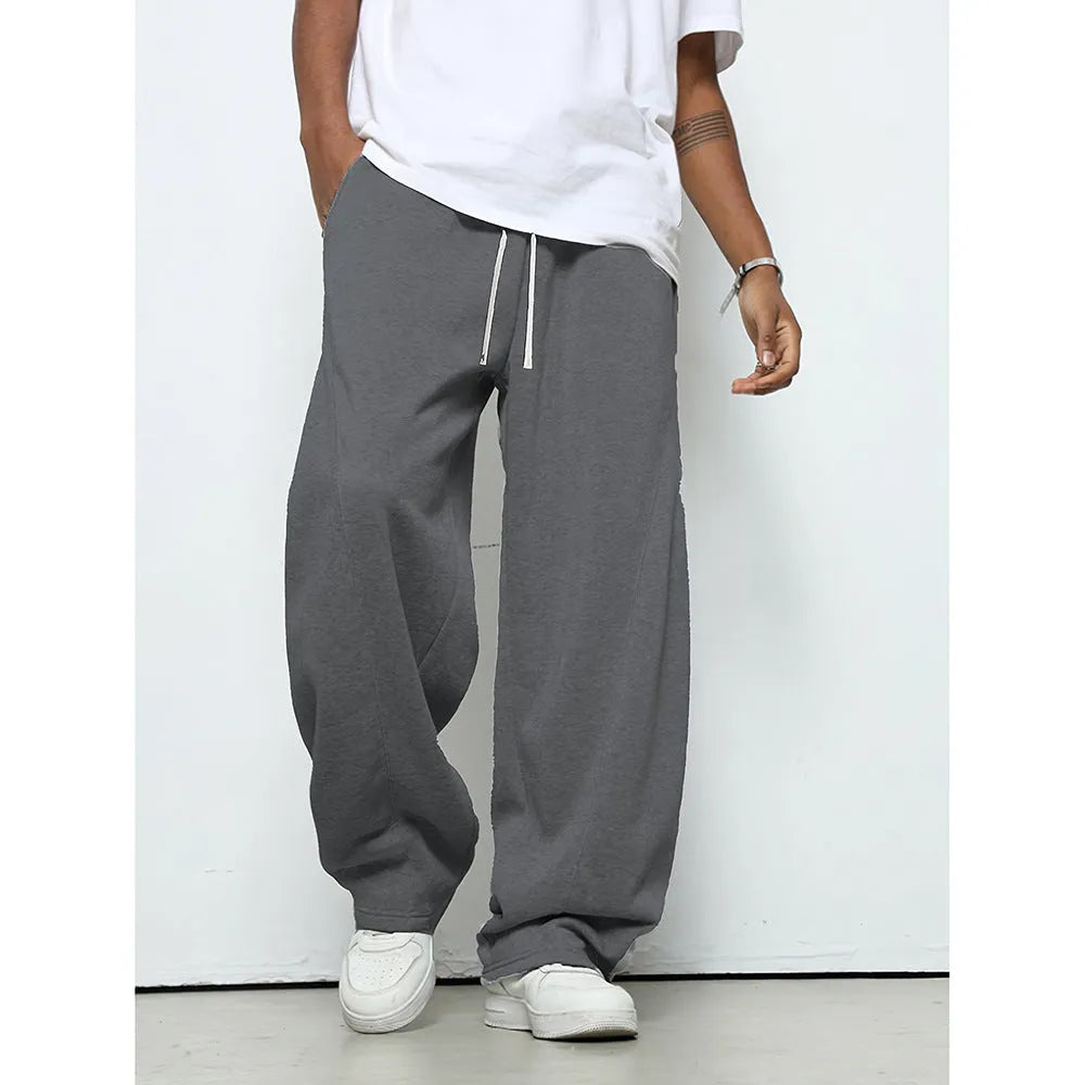 Men's straight-leg casual trousers in black with an elastic drawstring waistband.