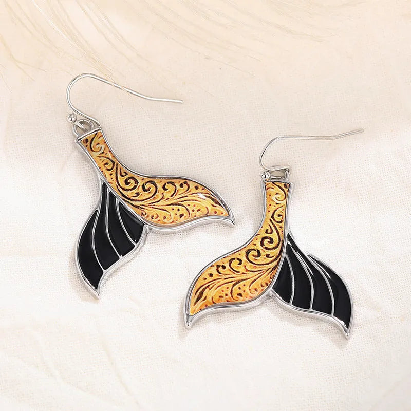 Women's white gold-colour fishtail earrings with whale design elements in retro style