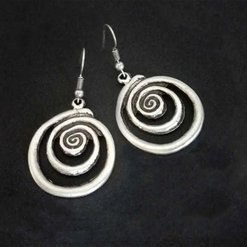 Geometric spiral earrings with distressed silver finish, measuring 5cm long