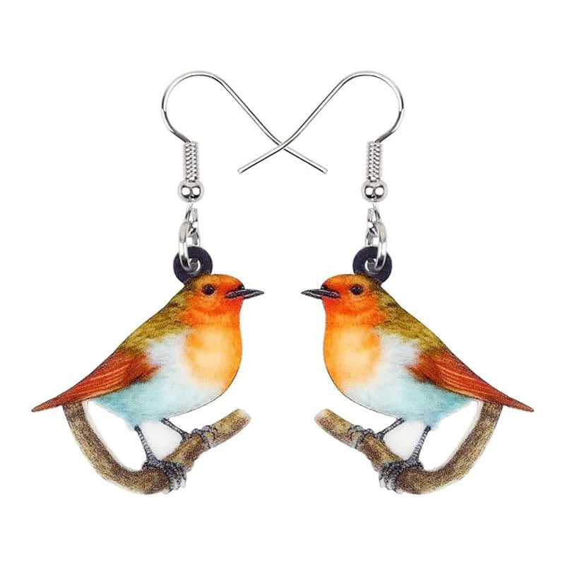 Blue titmouse bird design acrylic pendant earrings with geometric and snake detailing.