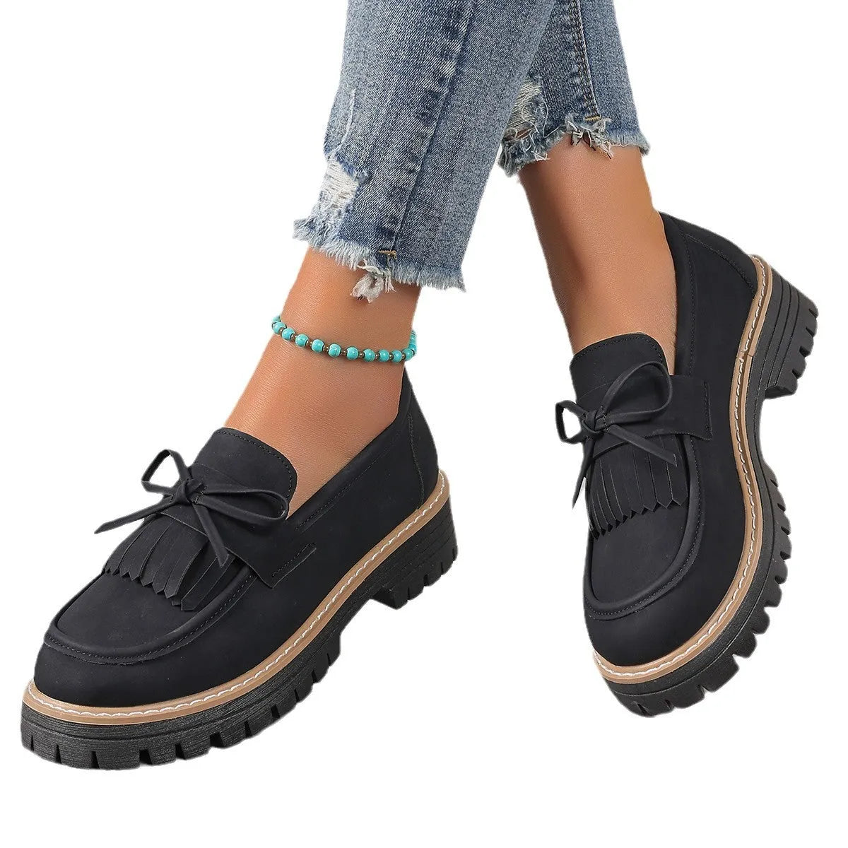 Black plus size women's loafers with tassel decoration, bowknot detail, and chunky heel