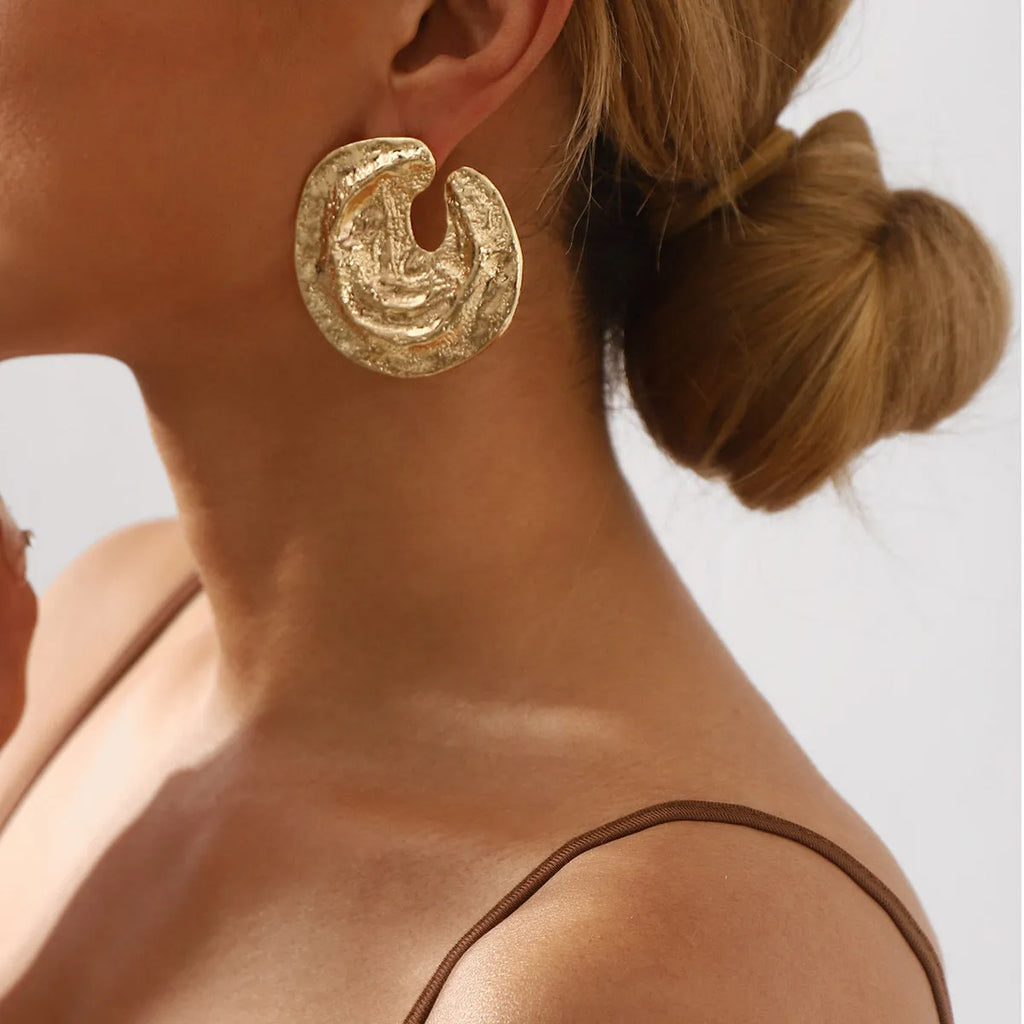 Geometric women's earrings with exaggerated pleated design and concave-convex texture in gold and white K colours