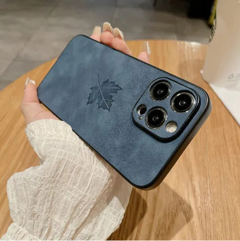 Skin feeling lambskin maple leaf phone case in blue for iPhone 17 with silicone protection