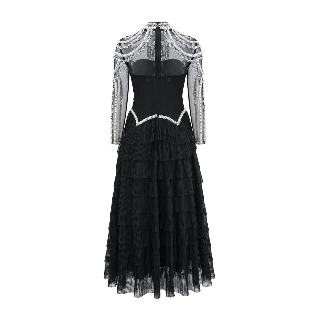 Women's long sleeve black beaded dress with three-dimensional decoration and mid-waist.