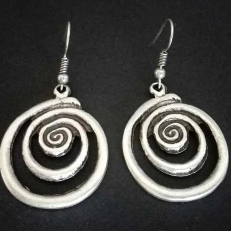 Geometric spiral earrings with distressed silver finish, measuring 5cm long
