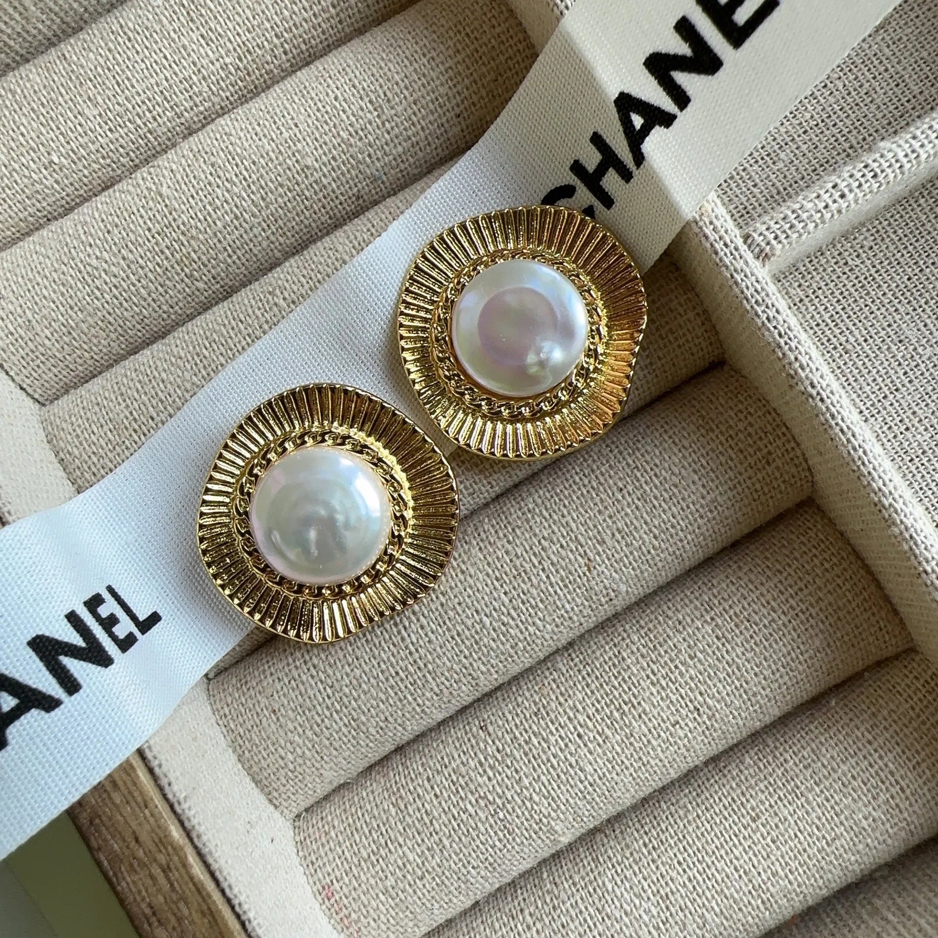 A pair of round gold electroplated earrings with a French retro simple style for women.
